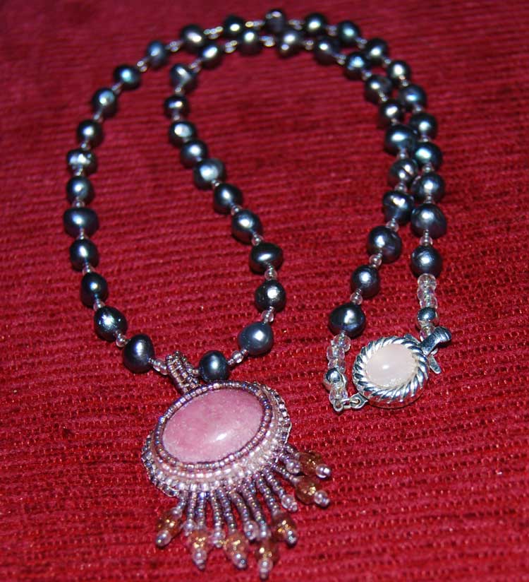 Rhodonite cabochon. Designed and crafted by Eileen Erinoff